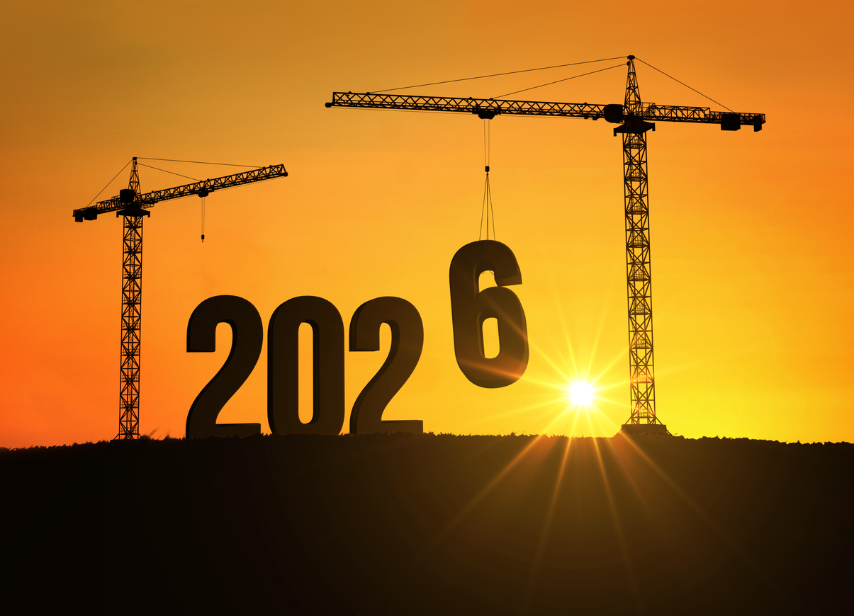Silhouette of cranes building the number 2026 at sunset, symbolizing progress, construction, and the beginning of a new year filled with hope, growth, and opportunities for the future. 2026